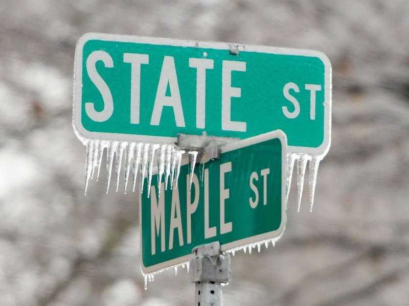 Icicles hang from the State and Maple Street sign in Sycamore on Wednesday, Dec. 30, 2020.