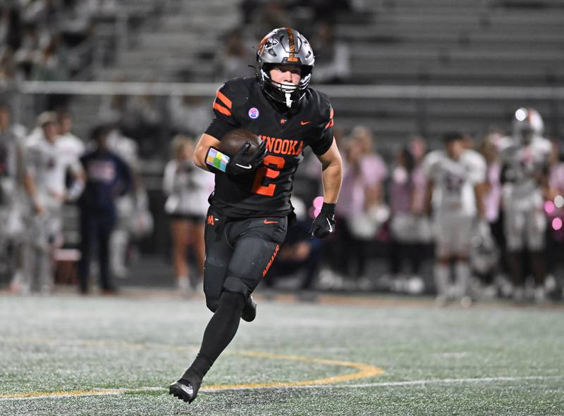 Minooka's Chase Nurczyk (2) runs the ball during the conference game against Oswego on Friday, OCT. 10, 2025, at Minooka.