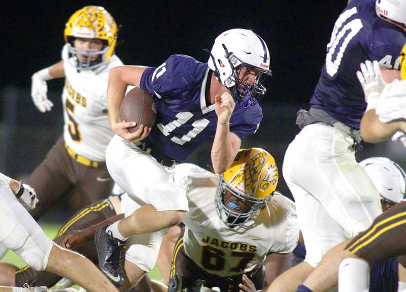Cary-Grove’s Peyton Seaburg runs the ball against Jacobs in varsity football on Friday, Sept. 20, 2024, at Al Bohrer Field on the campus of Cary-Grove High School in Cary.