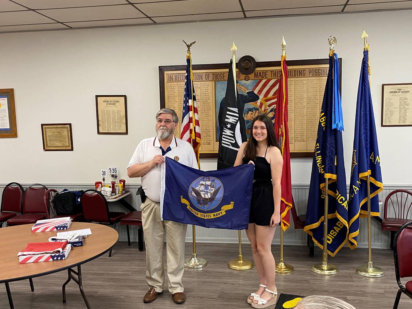 Skyler Milinkovic, of Coal City (right) with American Legion Commander Ken Buck. Milinkovic leaves for basic training to join the Navy in July.
