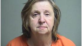 Hebron woman accused of shooting a firearm inside her home, hitting a TV and a wall