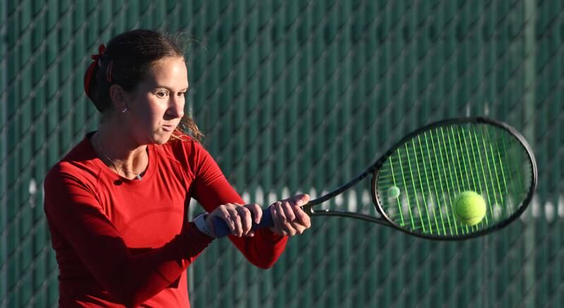 Benet Academy’s Katie Jendra returns the ball during Class 1A doubles third-place match of the girls state tennis tournament at Hersey High School on Saturday, Oct. 26, 2024 in Arlington Heights.