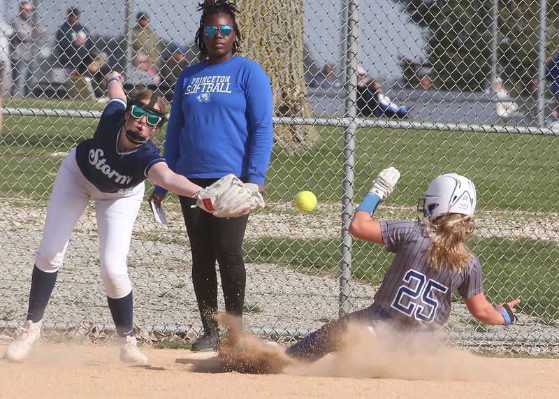 Princeton's Kelsea Klingenberg slides into third base as Bureau Valley's Kadyn Haage misses the throw on Thursday, April 25, 2024 at Bureau Valley High School.