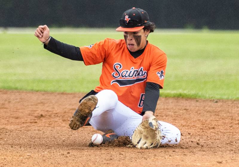 St. Charles East second baseman Antonio Perez snags a ball to make a play at first during a game against Wheaton Warrenville South in Wheaton on Wednesday, May 21, 2025.