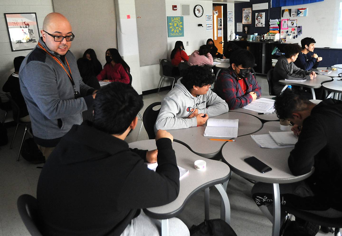 Otto Corzo talks with students Monday, April 11, 2022, as he teaches a Spanish literature class at McHenry High School. Corzo was named a Golden Apple finalist  this year for his teaching.