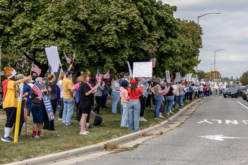 Protestors line Plainfield Road in Joliet during the No Kings Protest in Joliet on Oct. 18, 2025.