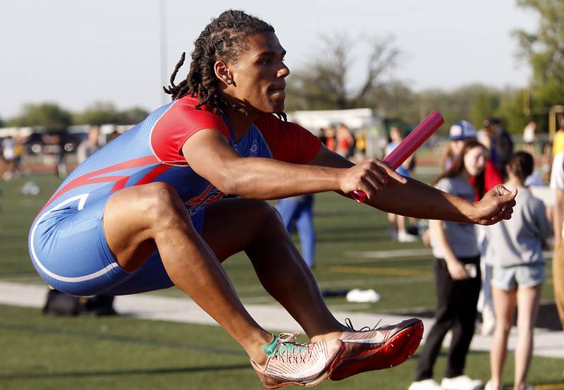 Dundee-Crown's Anthony Spain prepares to run the first leg of the 4x100 meter relay  during the Fox Valley Conference  Boys Track and Field Meet on Thursday, May 14, 2026, at Huntley High School.