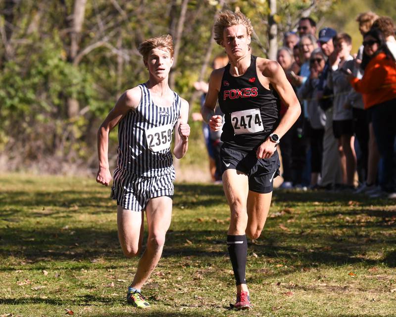 Yorkville's Owen Horeni, right, and Austin Cory of Plainfield South battle it out for the eighth and ninth spot of the Southwest Prairie Conference meet held at Channahon Community Park in Channahon.