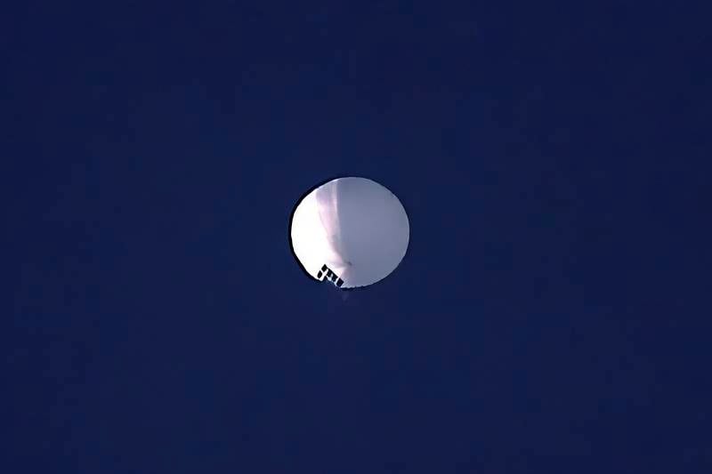 A high altitude balloon floats over Billings, Mont., on Wednesday, Feb. 1, 2023. The huge, high-altitude Chinese balloon sailed across the U.S. on Friday, drawing severe Pentagon accusations of spying and sending  excited or alarmed Americans outside with binoculars. Secretary of State Antony Blinken abruptly canceled a high-stakes Beijing trip aimed at easing U..S.-China tensions.(Larry Mayer/The Billings Gazette via AP)