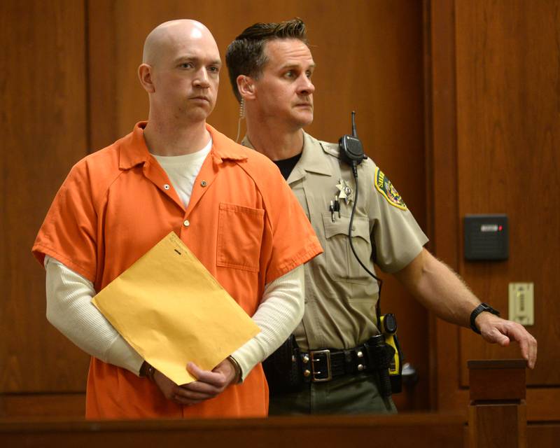 Matthew Plote, 36, of Malta, is escorted into an Ogle County courtroom by Ogle County Court Security Officer Dan Daub on Thursday, Sept. 7, 2023