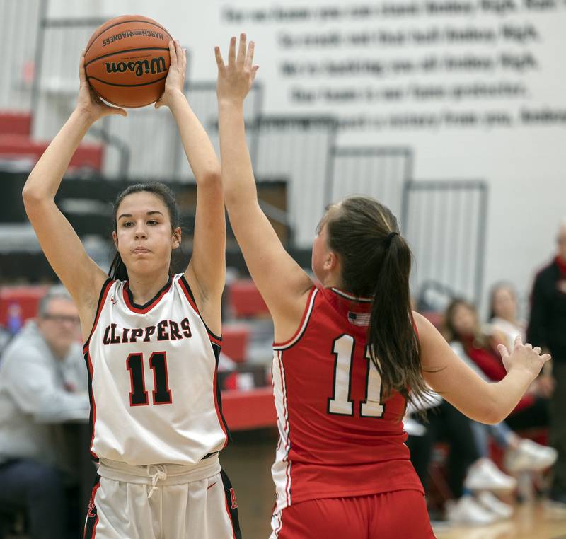 Amboy’s Tyrah Vaessen looks to pass against Hall’s Ella Sterling Wednesday, Dec. 27, 2023 during the Amboy Holiday Basketball tournament.