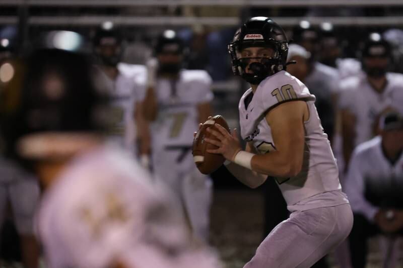 Burke Gautcher of Sycamore looks for receiver on Friday, October 11, 2024 at Howard Fellows Stadium in LaSalle.