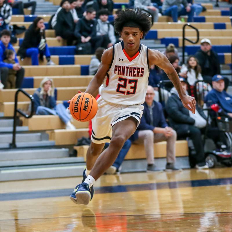 Oswego's Dasean Patton (23) drives to the basket during their basketball game between Yorkville at Oswego, Tuesday Dec 10, 2024 in Oswego.
