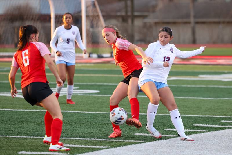 Bradley-Bourbonnais' Harper Tollefson and Kankakee's Stacy Calva battle for possession during the Boilermakers' 3-2 victory over Kankakee in the All-City matchup on Thursday, March 27.