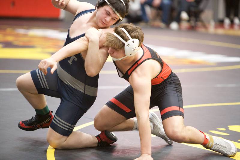 Batavia's Asher Sheldon competes against Oswego East's Josh Edwards in the 215 lb weight class at the Clint Arias Invitational on Saturday, Jan.18,2025 in Batavia.