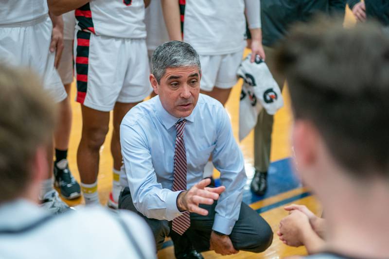 Benet’s head coach Gene Heidkamp talks to his players during the 4A Addison Trail Regional final against Bartlett at Addison Trail High School in Addison on Friday, Feb 24, 2023.