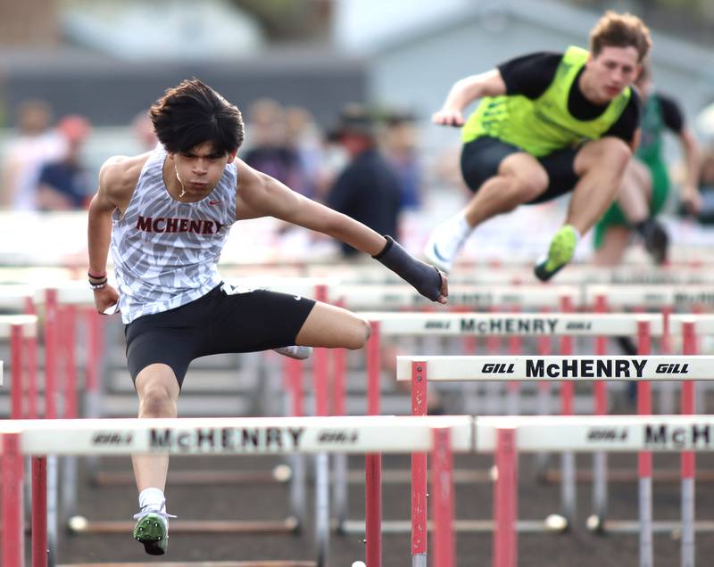 McHenry’s Christopher Hernandez competes in the 110-meter hurdles during the McHenry County Track and Field Meet at McCracken Field on Thursday, April 24, 2025, in McHenry