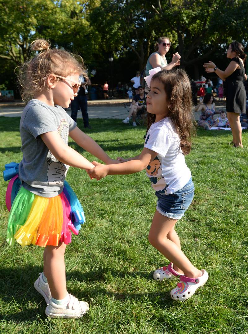 Children including Margot Laxton of Brookfield and Emi Gutierrez of Addison dance to polka music while attending the Octoberfest held at Brookfield Zoo Saturday, Sept. 23, 2023.