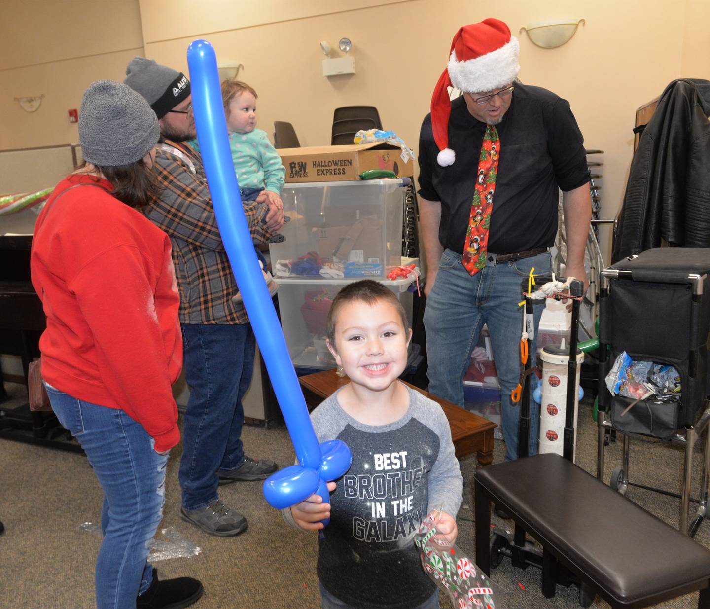 Kash Wilson, 5, of German Valley, shows the balloon sword he got at Oregon's Candlelight Walk on Saturday, Nov. 25. 2023. The event included Christmas music, shopping specials, and visits with Santa. Forreston's Christmas in the Country is this week and features several activities.