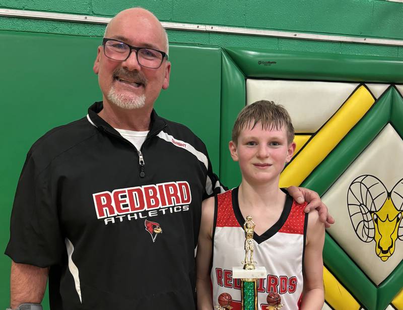 Stinnett Gettinger celebrating a victory with one of his track runners at Dwight Elementary School.