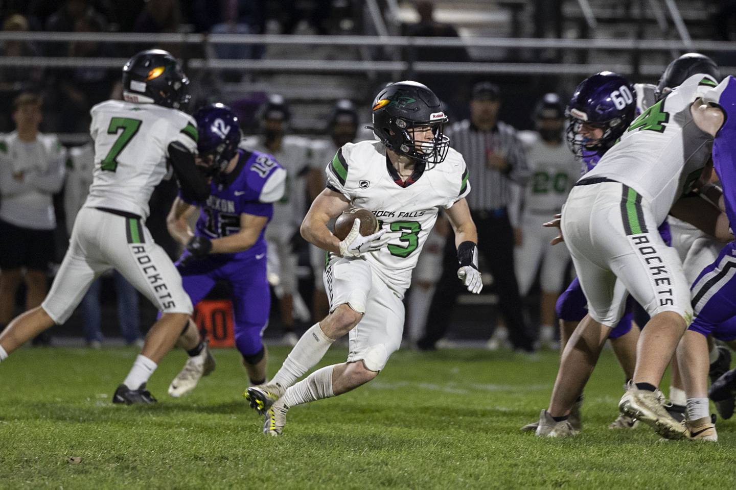 Rock Falls’ Brady Dowd picks up yards in the first quarter Friday, Oct. 21, 2022 against Dixon.