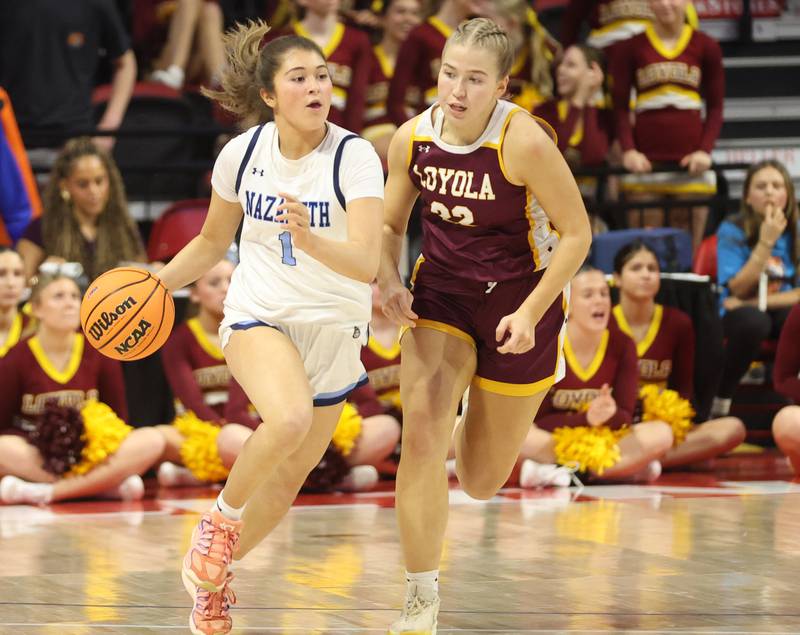 Nazareth's Annalise Crudele dribbles up the floor against Loyola's Liesel Klein during the Class 4A State girls basketball championship game on Saturday, March 7, 2026 at CEFCU Arena in Normal.