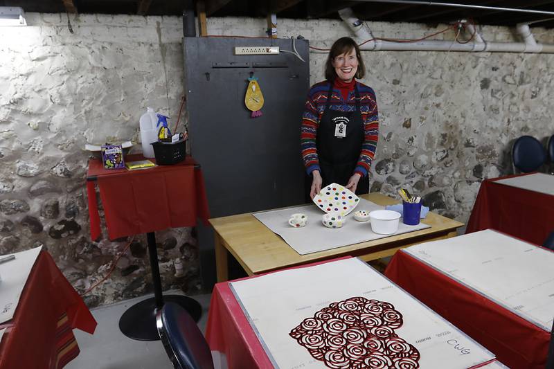 Anne Marie Whitmore Lenzini of the Clayworkers' Guild of Illinois inside the guilds classroom and event space on Fen 5, 2025, in the basement of their Artisans on Main gallery in Woodstock. The guild is expanding their Artisans on Main gallery into a neighboring space behind their Woodstock location. The space, that was formerly the Woodstock Tobacco Hub, will house the guild's classroom space.