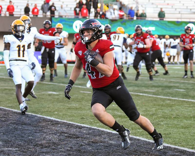 Northern Illinois Drew Cassens runs in for a touchdown after catching a pass by QB Ethan Hampton in the 4th quarter on Saturday Oct. 8th while taking on Toledo.