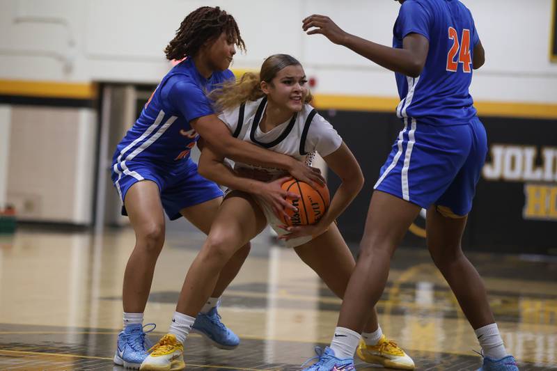 Joliet West’s Niyonna Reddington wins the battle for the loose ball against Butler College Prep on Tuesday, Dec. 16, 2025 in Joliet.