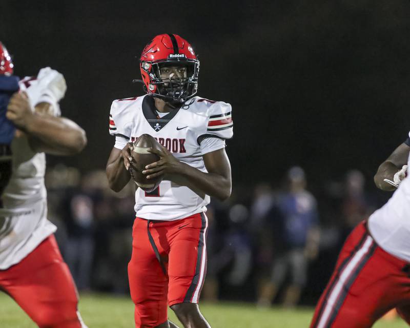 Bolingbrook's Tyson Ward (7) sets up to pass during football game between Bolingbrook at Oswego Friday, Sept 12, 2025  in Oswego.