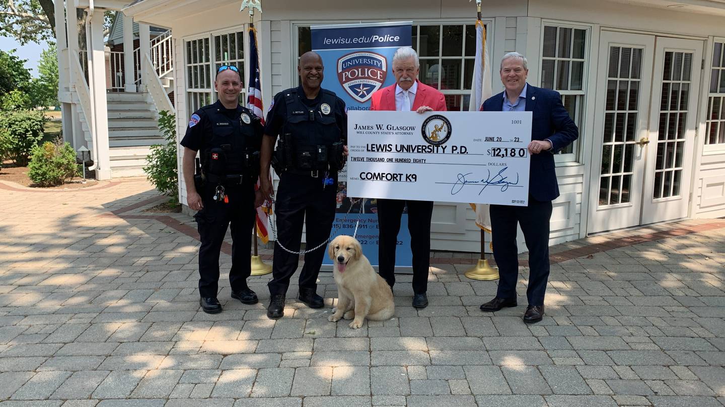 The Lewis University police department in Romeoville now has an on-campus emotional support animal. Jet joined Lewis University’s police department through the support of Will County State’s Attorney James Glasgow. Pictured, from left, is LUPD Chief Mike Zegadlo, LUPD Sgt. Lyle Nettles, Jim Glasgow and Lewis University President David Livingston.