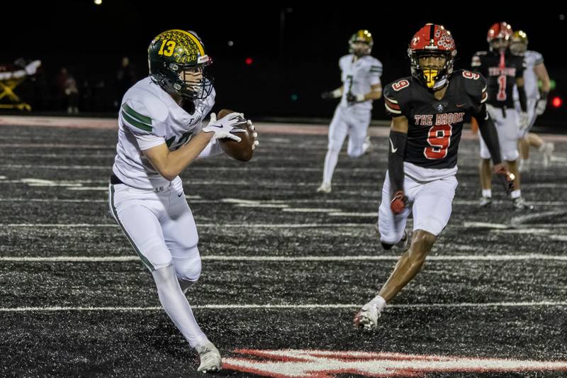 Fremd’s Carter MacDonald makes a nice catch during an 8A varsity football playoff game against Bolingbrook at Bolingbrook on Nov. 15, 2025.