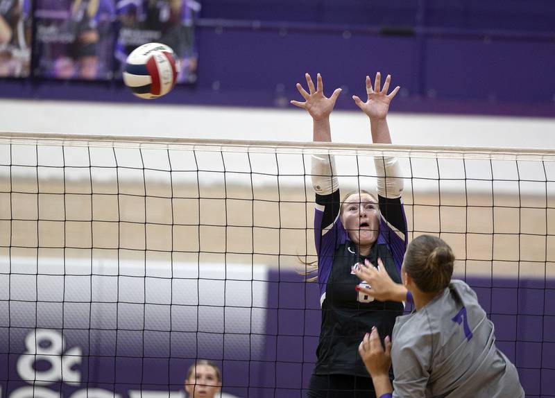 Dixon’s Rayven Mowery goes up to block a shot by Rochelle’s Meredith Bruns Thursday, August 28, 2025.