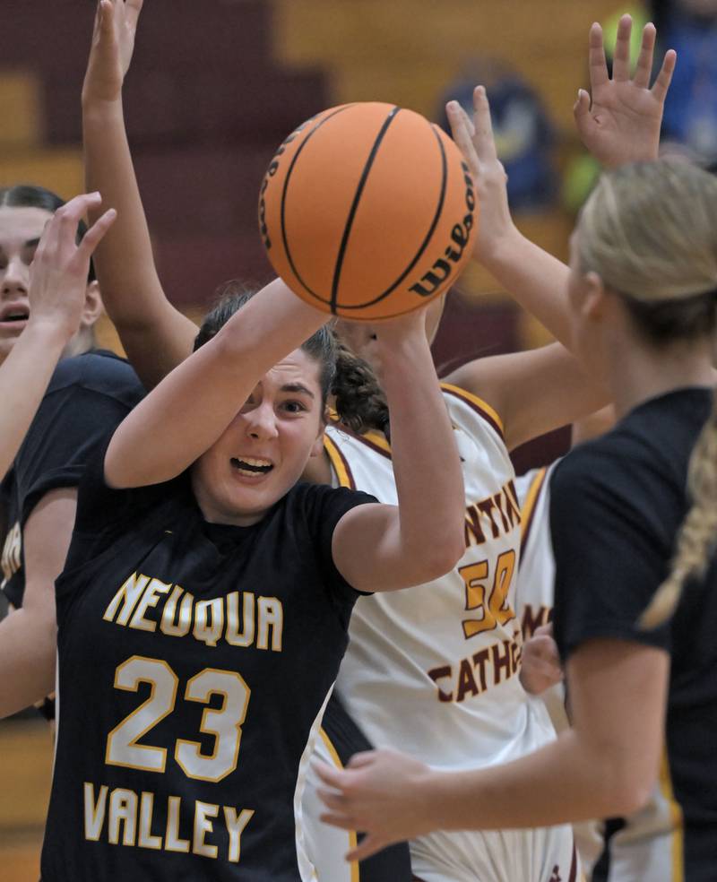 Neuqua Valley’s Alexis May scrambles for the ball against Montini in a girls basketball game at Montini Catholic High School in Lombard Monday.