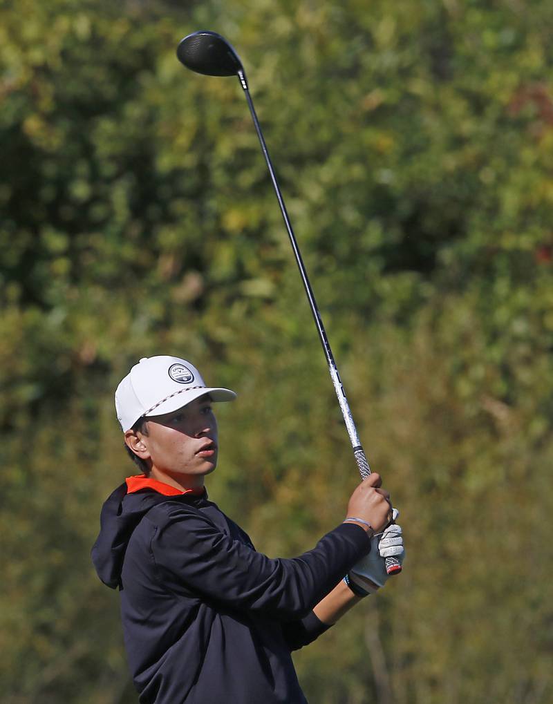 Crystal Lake Central’s Max Sinha watches his tee shot on the seventh hole during the IHSA Class 3A Dundee-Crown Regional golf tournament on Wednesday, Oct. 2, 2024 at Randall Oaks Golf Club in West Dundee.