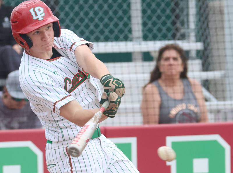 L-P's Braylin Bond makes contact with the ball while playing Morris on Friday, April 17, 2026 at Huby Sarver Field in the L-P Athletic Complex in La Salle.