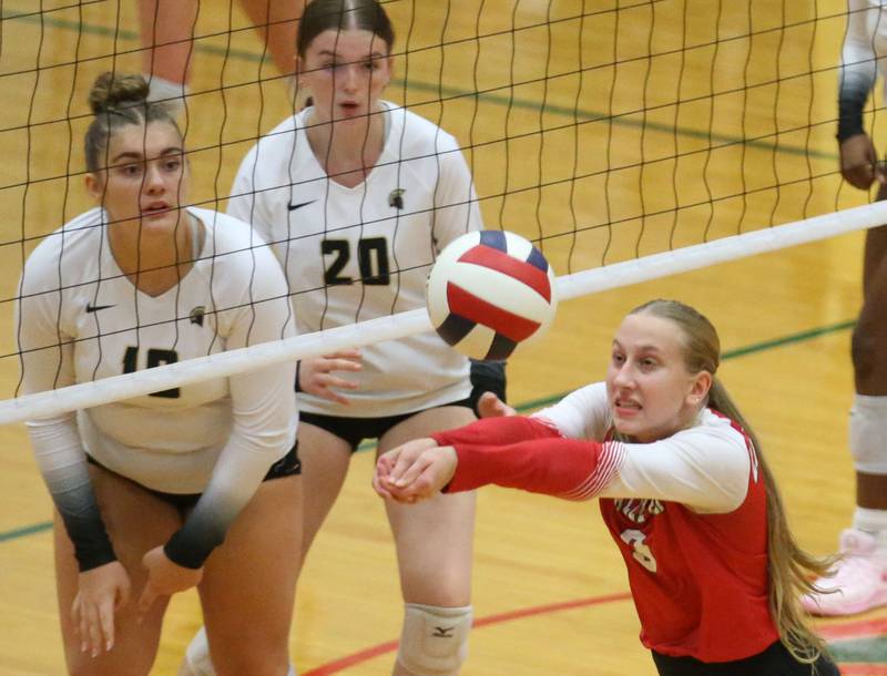 L-P's Aubrey Urbanski keeps the ball alive as Sycamore's Sophia Martinez and teammate Sophia Martinez watch on Tuesday, Sept. 23, 2025 in Sellett Gymnasium at L-P High School.