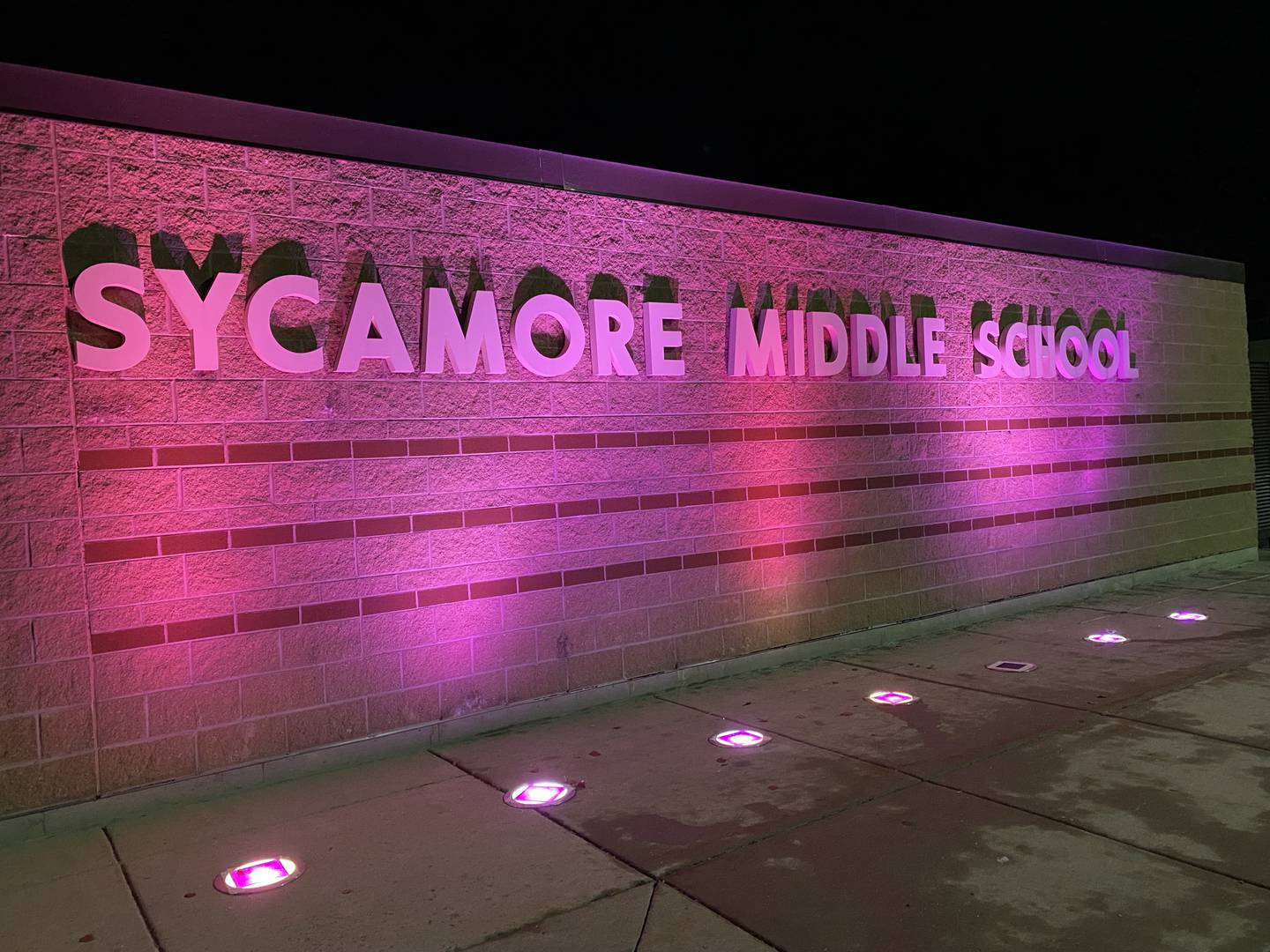Purple lights gleam outside Sycamore Middle School, 150 Maplewood Drive, in honor of Sycamore sixth grader Maggie Green, 11, who died Wednesday, Nov. 29, 2023, from cancer. Purple lights have been displayed across town for weeks to support Maggie and her family. Purple was Maggie's favorite color.