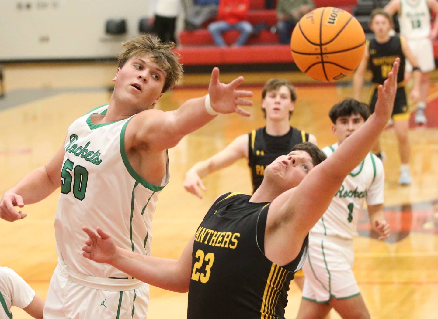 Rock Falls's Austin Castaneda eyes the hoop against Putnam County's AJ Furar during the 50th annual Colmone Classic on Monday, Dec. 9, 2024 at Hall High School.