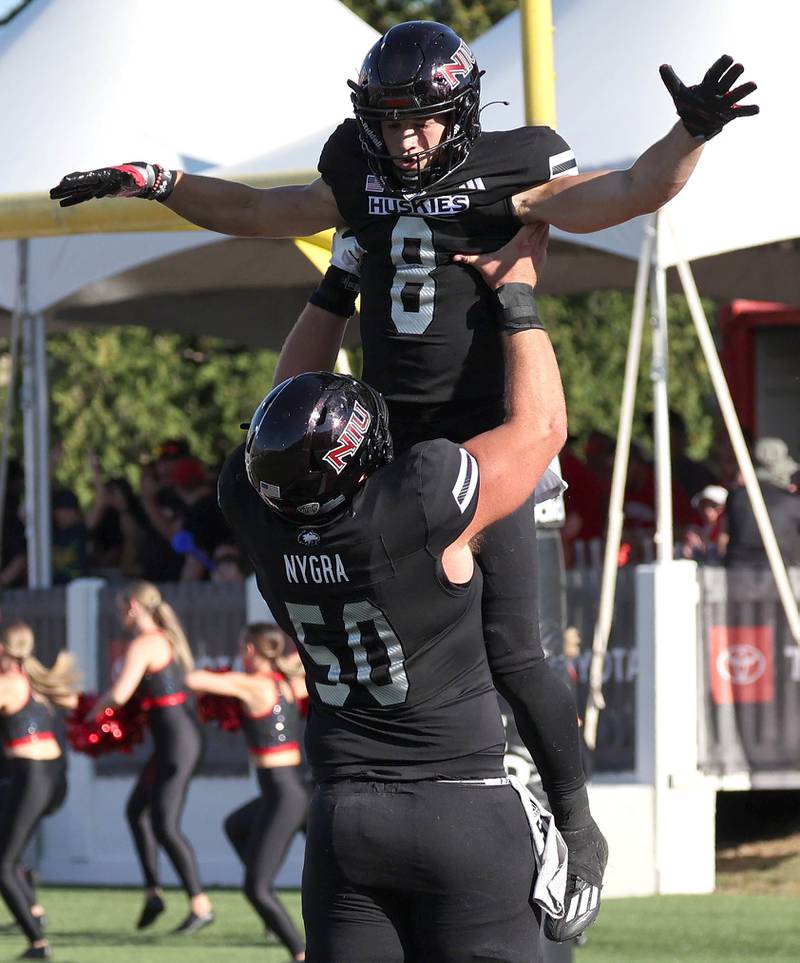 Northern Illinois' Kacper Rutkiewicz celebrates with teammate Pete Nygra after his touchdown catch during their game against Southern Illinois Saturday, Sept. 9, 2023, in Huskie Stadium at NIU in DeKalb.