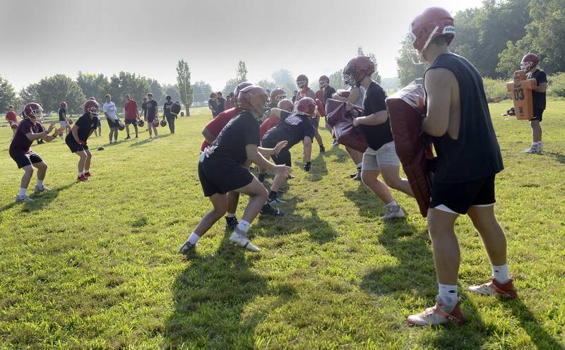 Yorkville players run drills during football practice at Yorkville High School on Tuesday, Aug 8, 2023.