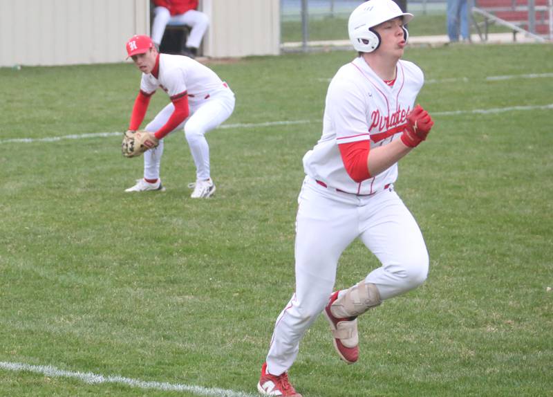 Ottawa's Jackson Mangold beats out the throw to first base as Hall's Jack Curran throws late to the bag on Tuesday, April 1, 2025 at Ottawa High School.