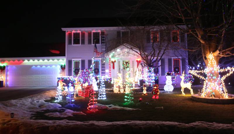 Christmas lights fill the lawn of a home in the 1600 block of 26th Street on Wednesday, Dec. 17, 2025 in Peru.