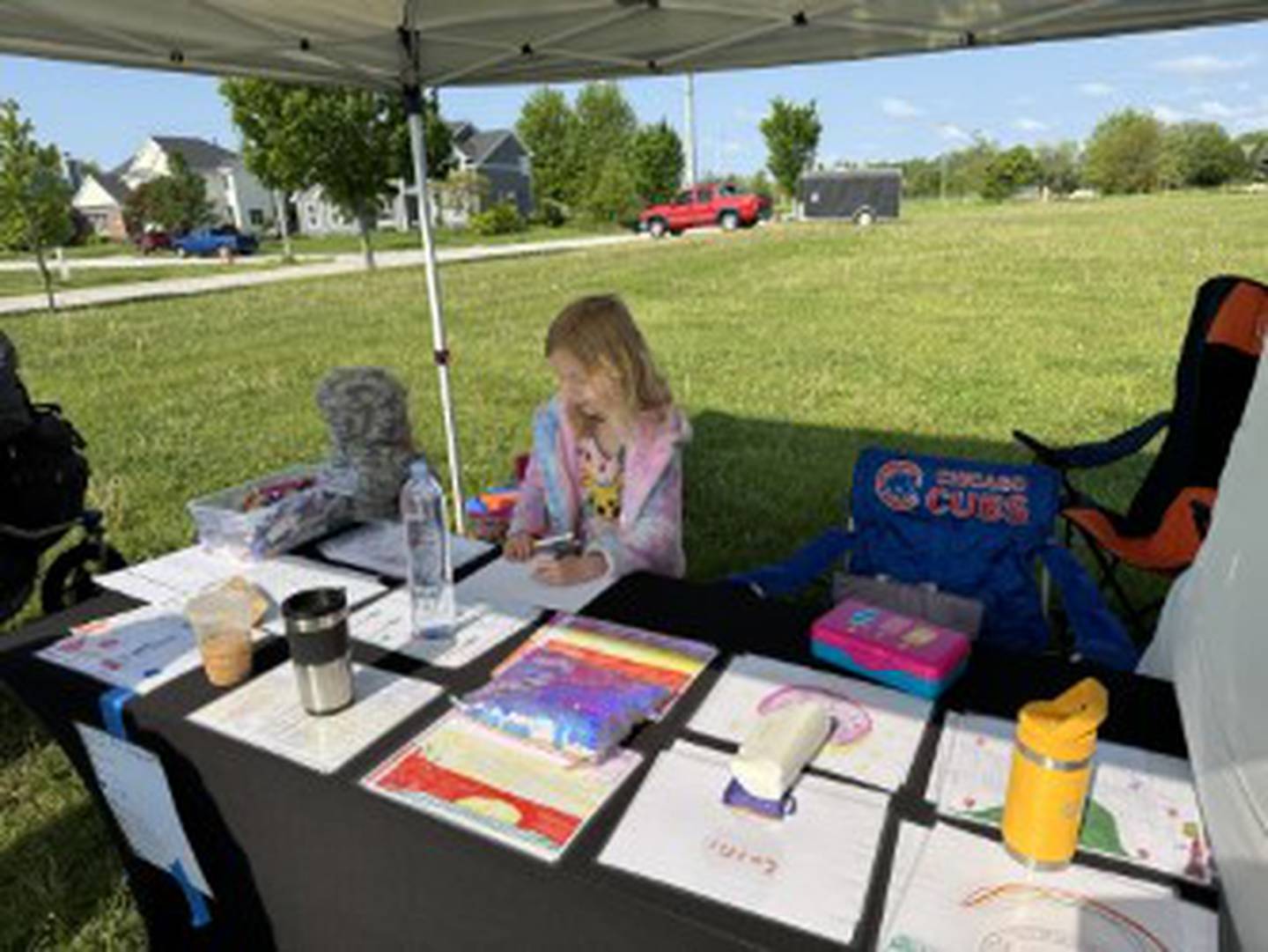 Emily York, 8, of Homer Glen, sold her original artwork at a children's business fair in May. Her mother Ashley York, owner of Realtopia Real Estate, is partnering with the city of Lockport and Lupine Montessori School to host Acton Children’s Business on Sept. 17 on the lawn outside Lockport’s city hall. The fair will feature 40 young entrepreneurs. Applications are now open.