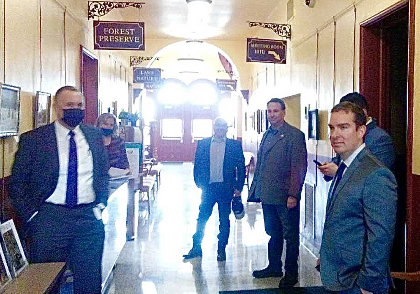 The Kendall County Board started its Jan. 18 meeting in the main corridor of the 1887 Historic Courthouse. Seen here from left is Kendall County State's Attorney Eric Weis, County Clerk Debbie Gillette, county board members Ruben Rodriguez and Dan Koukol and board Chairman Scott Gryder. (Mark Foster - mfoster@shawmedia.com)