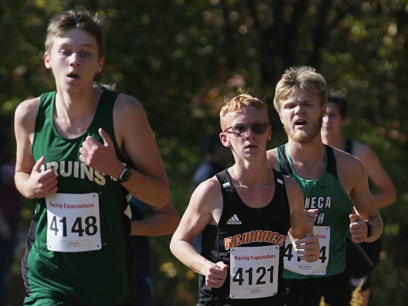 St. Bede's Haiden Ator, Kewanee's Jason Rusk and Seneca's Logan Pasakarnis runs in the Class 1A Regional Cross Country boys race on Saturday, Oct. 22, 2022 at the Seneca FFA Farm in Marseilles.