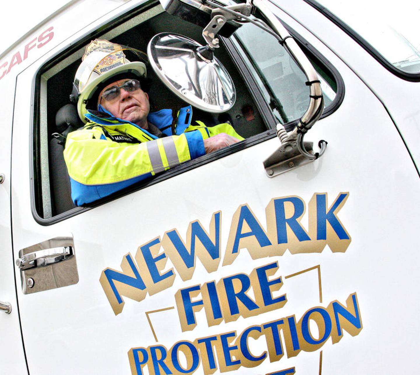 Newark Fire Protection District Lowell Mathre sits in one of the unit's trucks. Mathre — who in May will celebrate his 51st anniversary as a Newark firefighter — has lived in town since he was 10 years old.