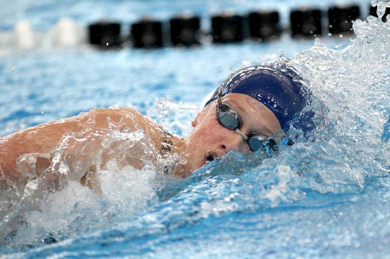 Oswego's Corinne Guist swims in the championship heat of the 200-yard freestyle during the IHSA Girls State Swimming and Diving Championships at FMC Natatorium in Westmont on Saturday, Nov. 13, 2021.