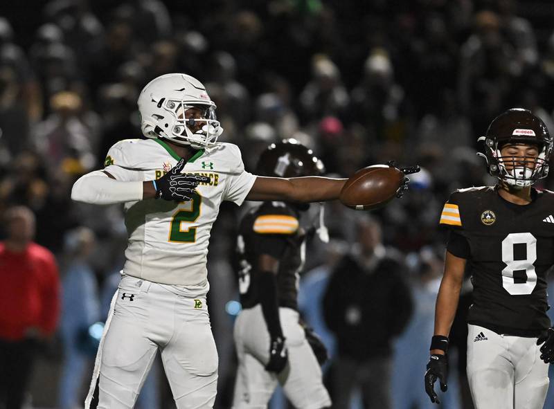 Providence Catholic's Xavier Coleman (2) reacts to catching a pass for a first down during the conference game against Joliet Catholic's on Friday, OCT. 24, 2025, at Joliet.