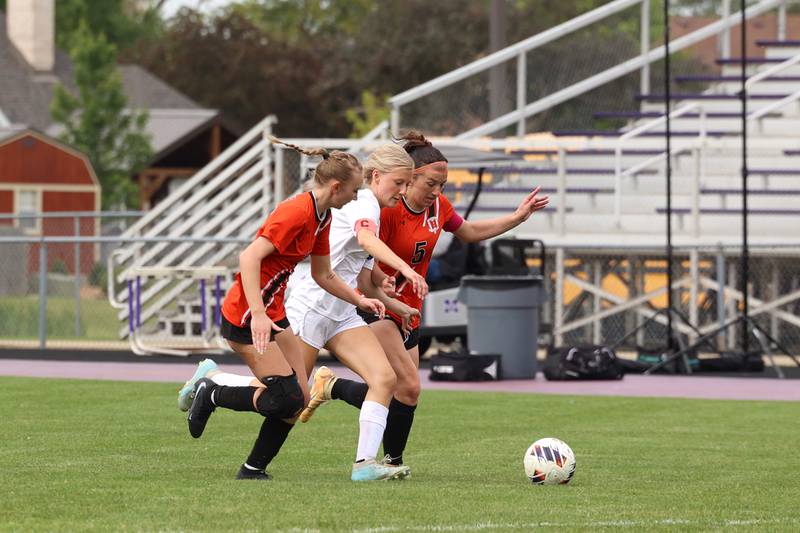 Peotone's Allie Werner makes a run under pressure from Beecher's Saiorse Loonam, left, and Teagan Claus during Peotone's 2-1 victory over Beecher in the Class 1A Manteno Regional championship on Friday, May 22, 2026.